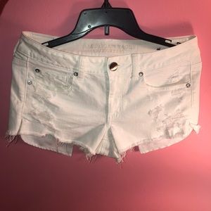 White ripped denim shorts from American Eagle